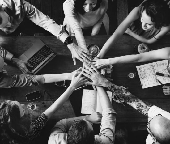 group diverse people with joining hands teamwork